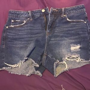 Time and True, high rise ripped blue jean shorts.
